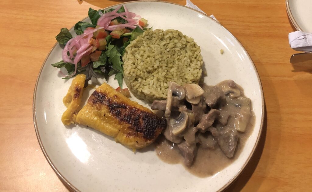 Food in Bogota, Colombia. A dish of rice, meat, salad and fried. banana